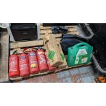The front row of the pallet comprising 7 fire extinguishers plus quantity of first aid equipment