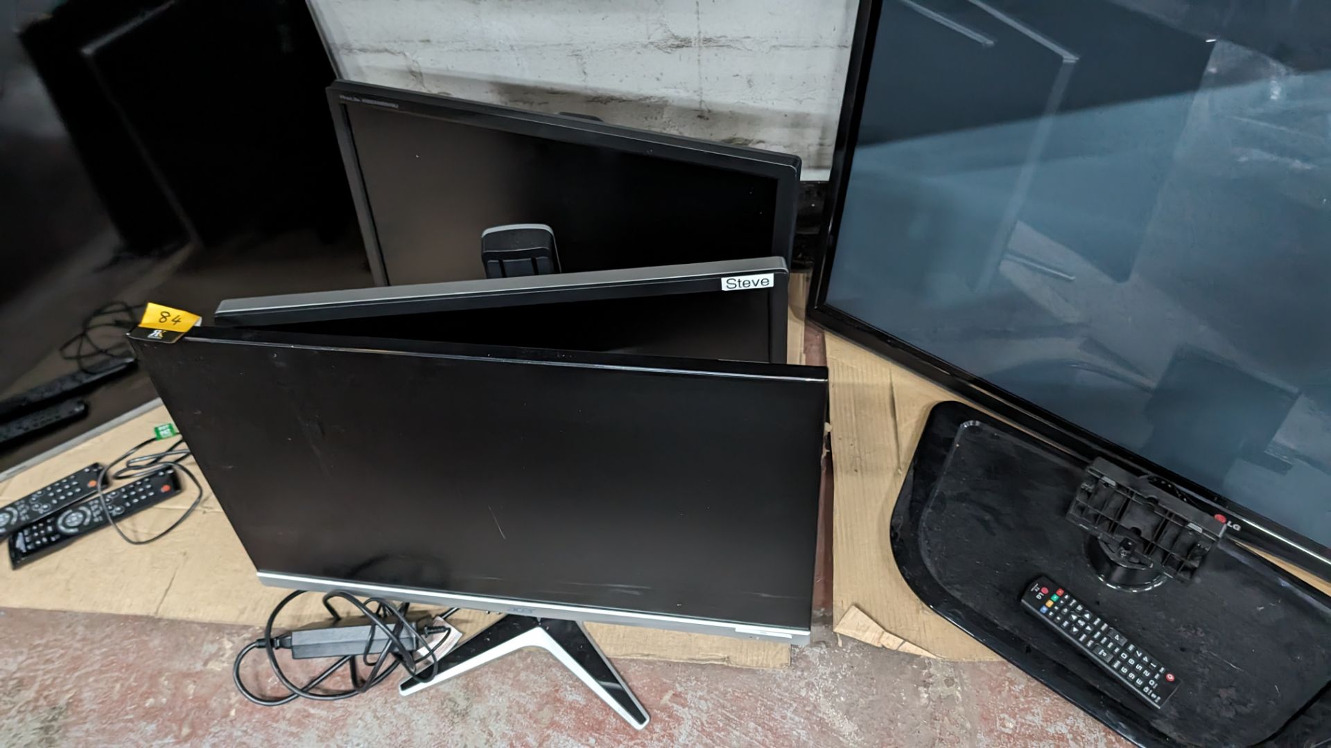 3 off assorted widescreen monitors, each on desktop stand