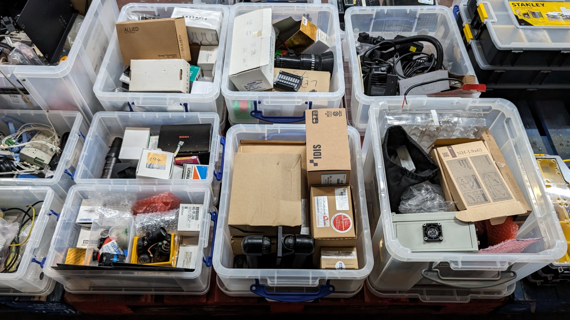 The contents of a pallet of CCTV camera components, lenses and similar