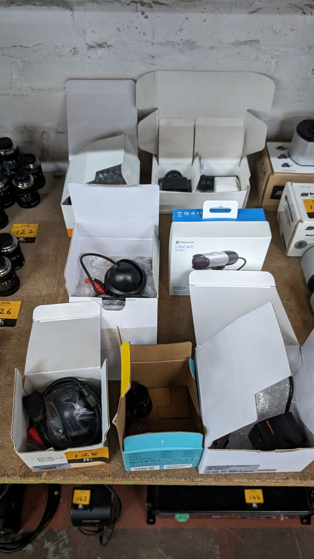 Quantity of assorted cameras, lenses and other related equipment, comprising 7 x boxes and their con