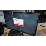 LG widescreen flat panel TV with remote control and table top stand