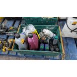 The contents of a crate of assorted fluids including chain oil, de-icer & more