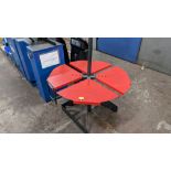 Metal multi-adjustable round table understood to be for use with coils of tubing