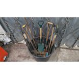 Bucket & contents of assorted long handled spades, forks & other garden implements