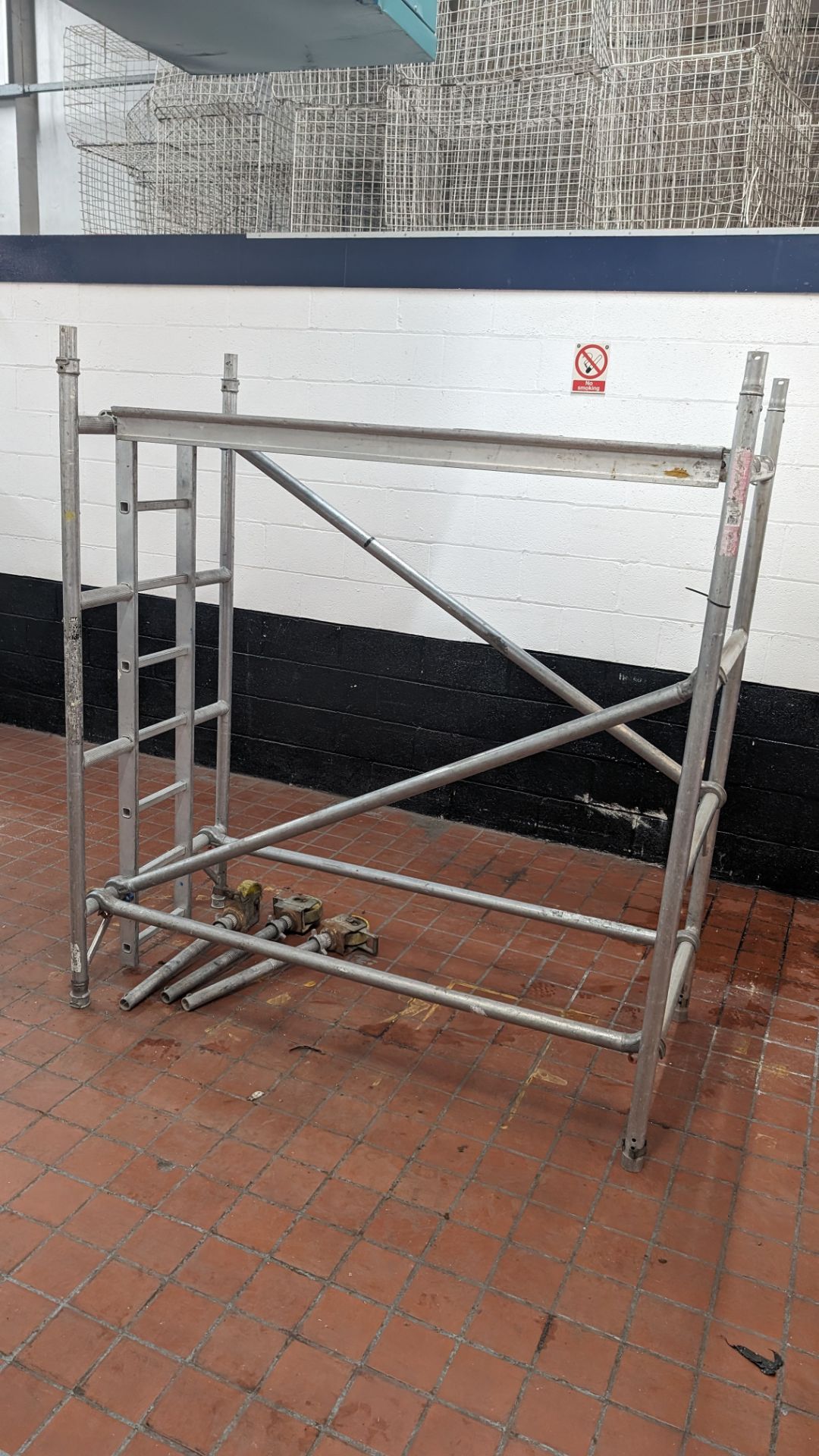 1 off small scaffold tower comprising 2 uprights, 4 beams/braces, 1 platform & 3 wheels