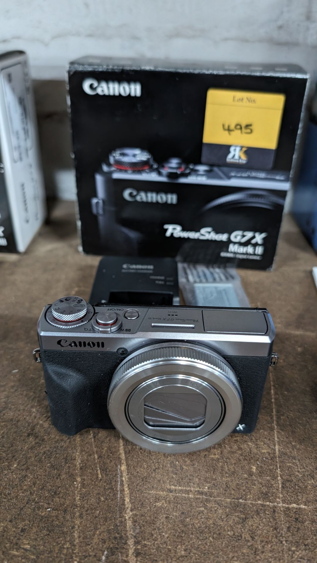 Canon PowerShot G7X Mark II camera, including battery and charger