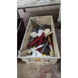 The contents of a crate of assorted utensils