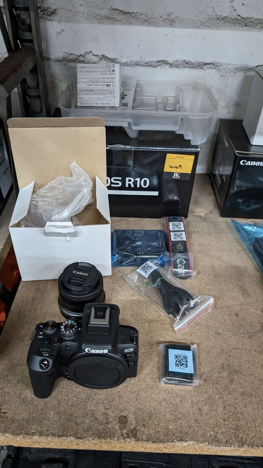 Canon EOS R10 camera kit, including 18-45mm lens, plus strap, battery, charger, cable and more