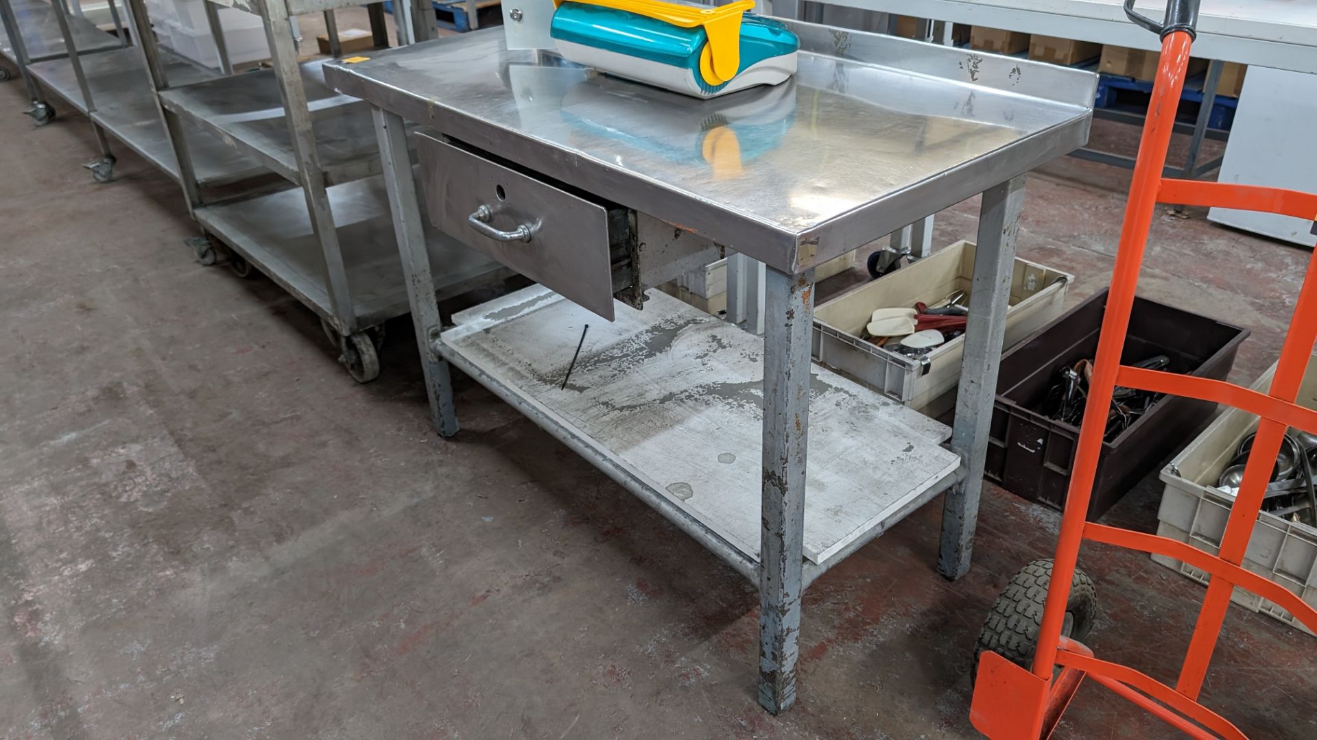 Stainless steel topped table with pull out drawer