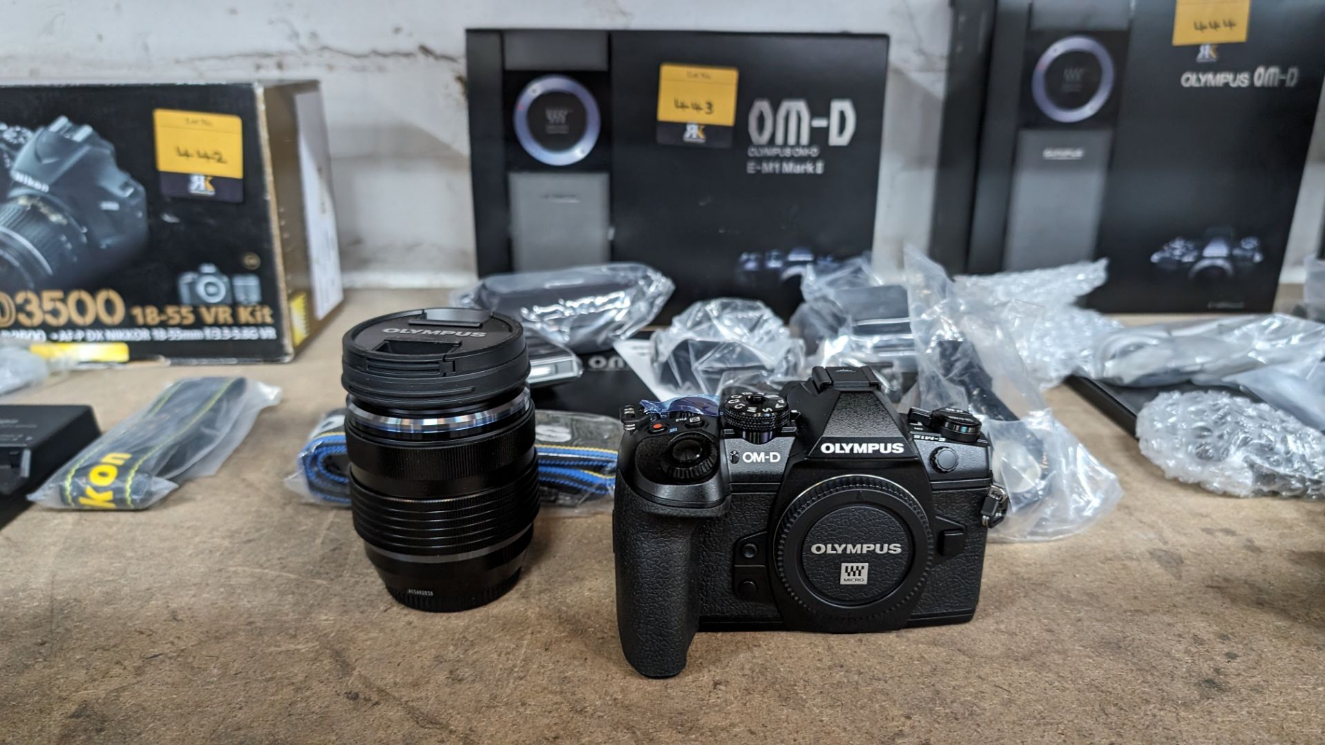 Olympus OM-D E-M1 Mark II micro camera kit, including camera body, strap, battery, charger, USB cabl