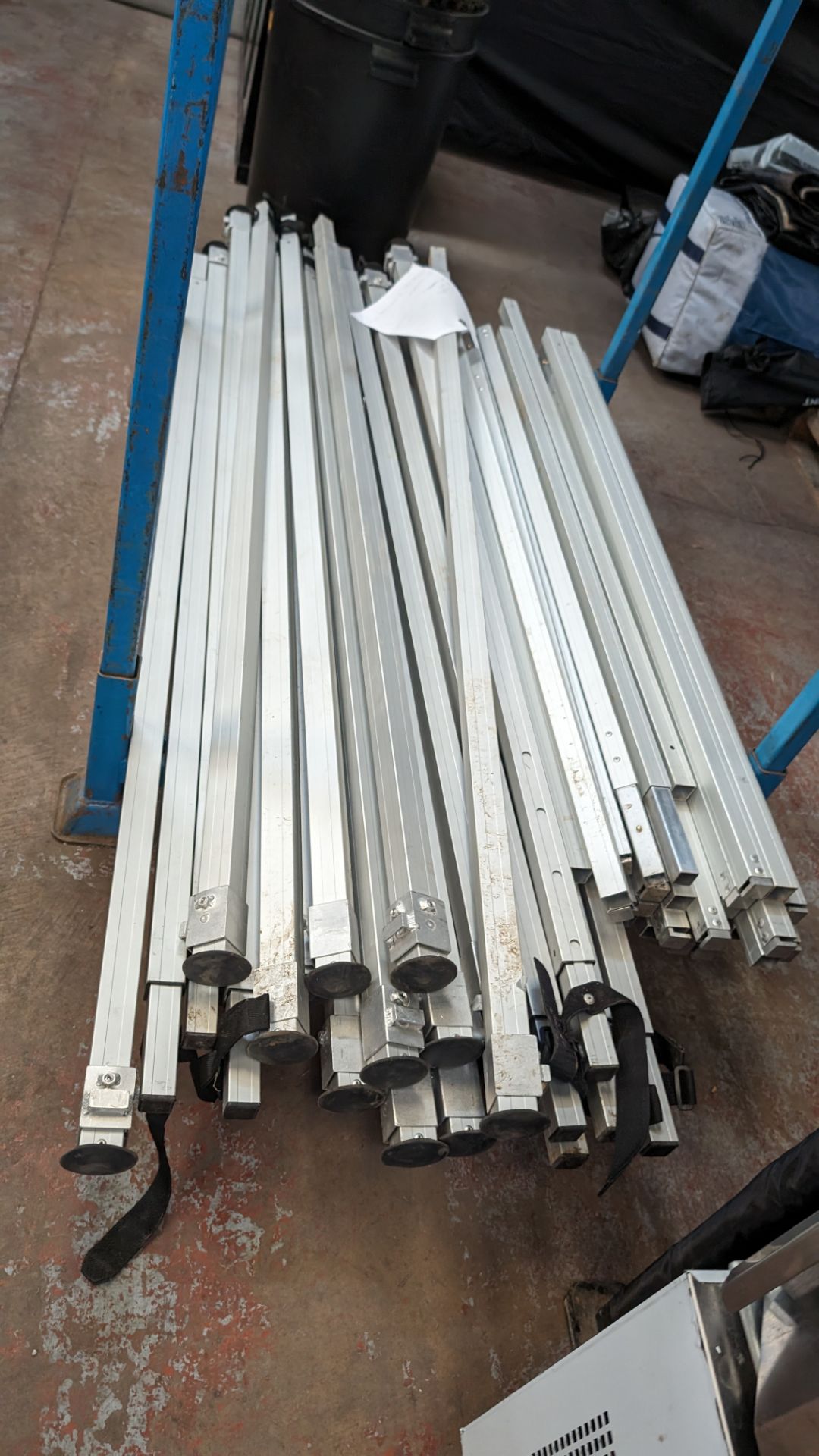 The contents of a stillage of marquee/tent related height adjustable poles and connecting pieces. C - Image 6 of 8