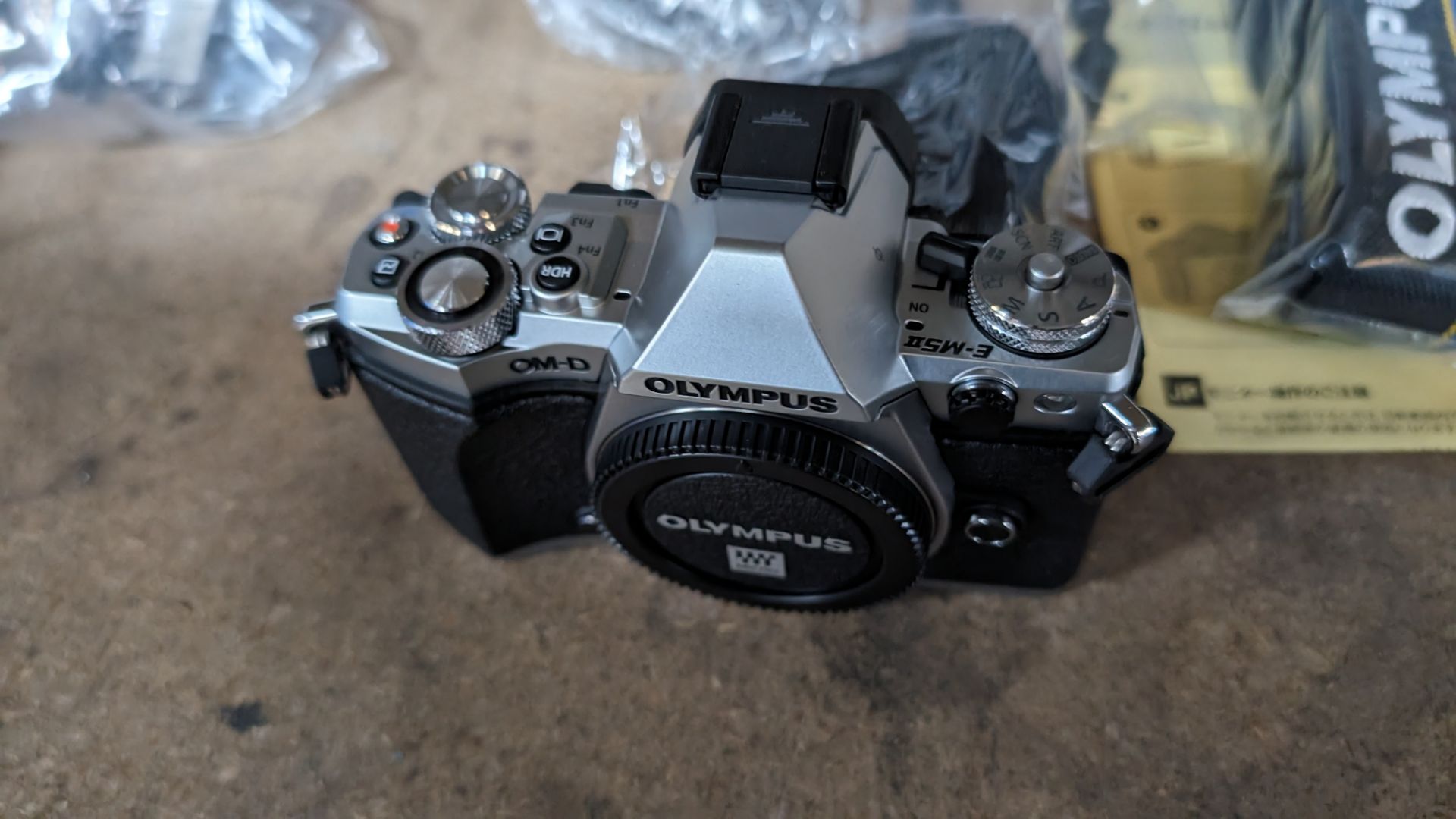 Olympus OM-D E-M5 Mark II camera kit, including camera body, electronic flash, strap, battery, charg - Image 7 of 12