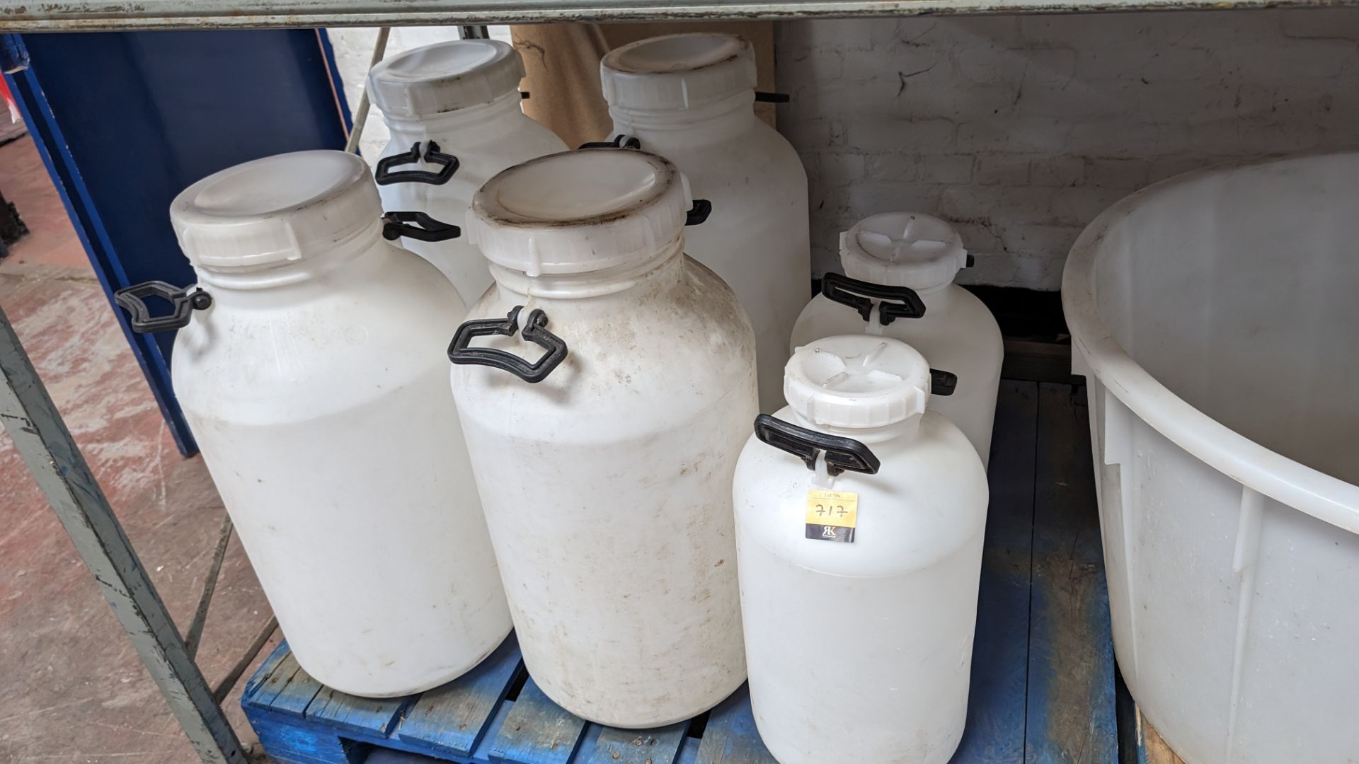 6 large and extra large plastic milk churns with lids
