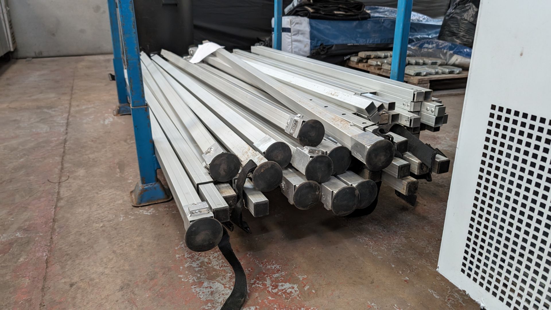 The contents of a stillage of marquee/tent related height adjustable poles and connecting pieces. C - Image 8 of 8