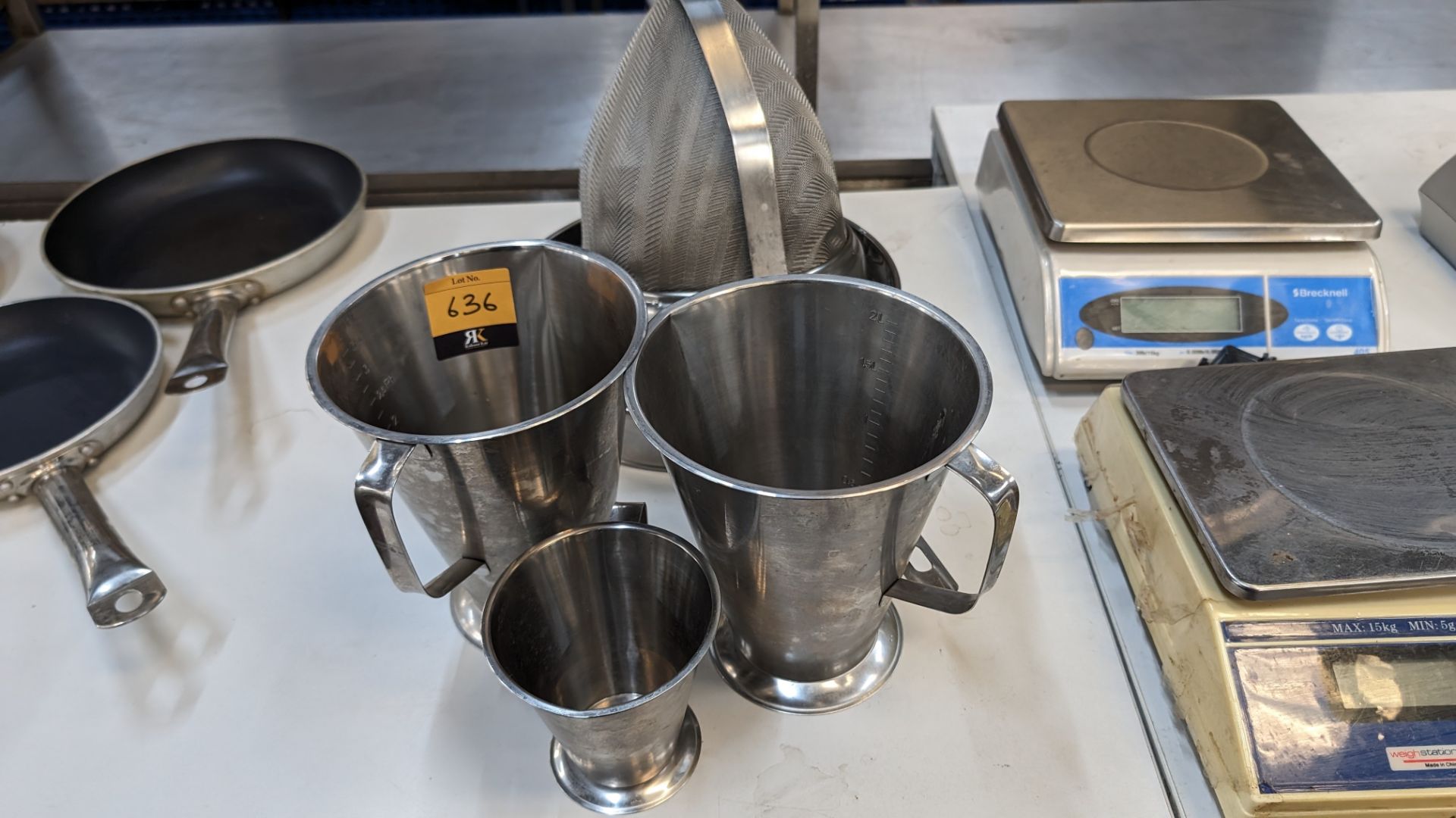 3 assorted stainless steel jugs and 3 assorted sieves