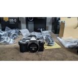 Olympus OM-D E-M5 Mark II camera kit, including camera body, electronic flash, strap, battery, charg