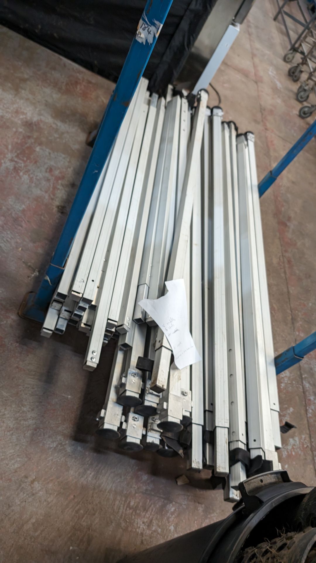 The contents of a stillage of marquee/tent related height adjustable poles and connecting pieces. C - Image 3 of 8