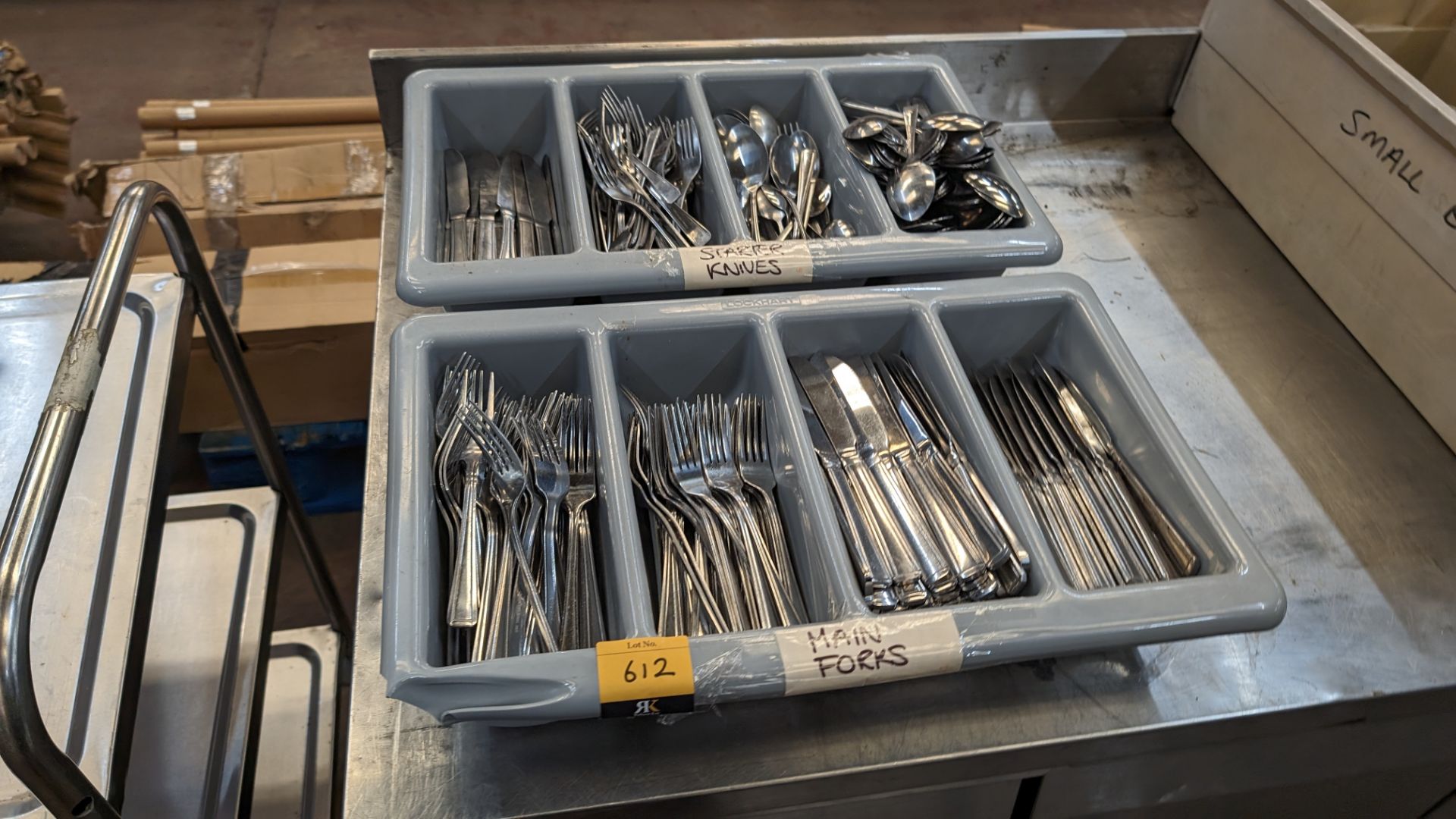 2 trays of cutlery and their contents