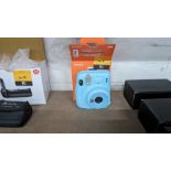 Fujifilm Instax Mini 11 instant camera. In sky blue