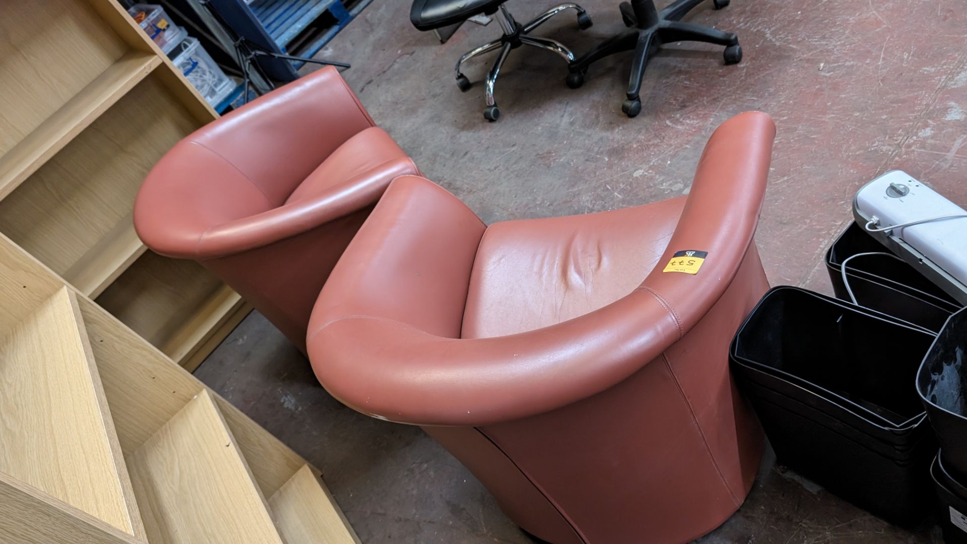 Pair of tub chairs on wheels in dark salmon/terracotta leather/pleather finish - Image 6 of 8