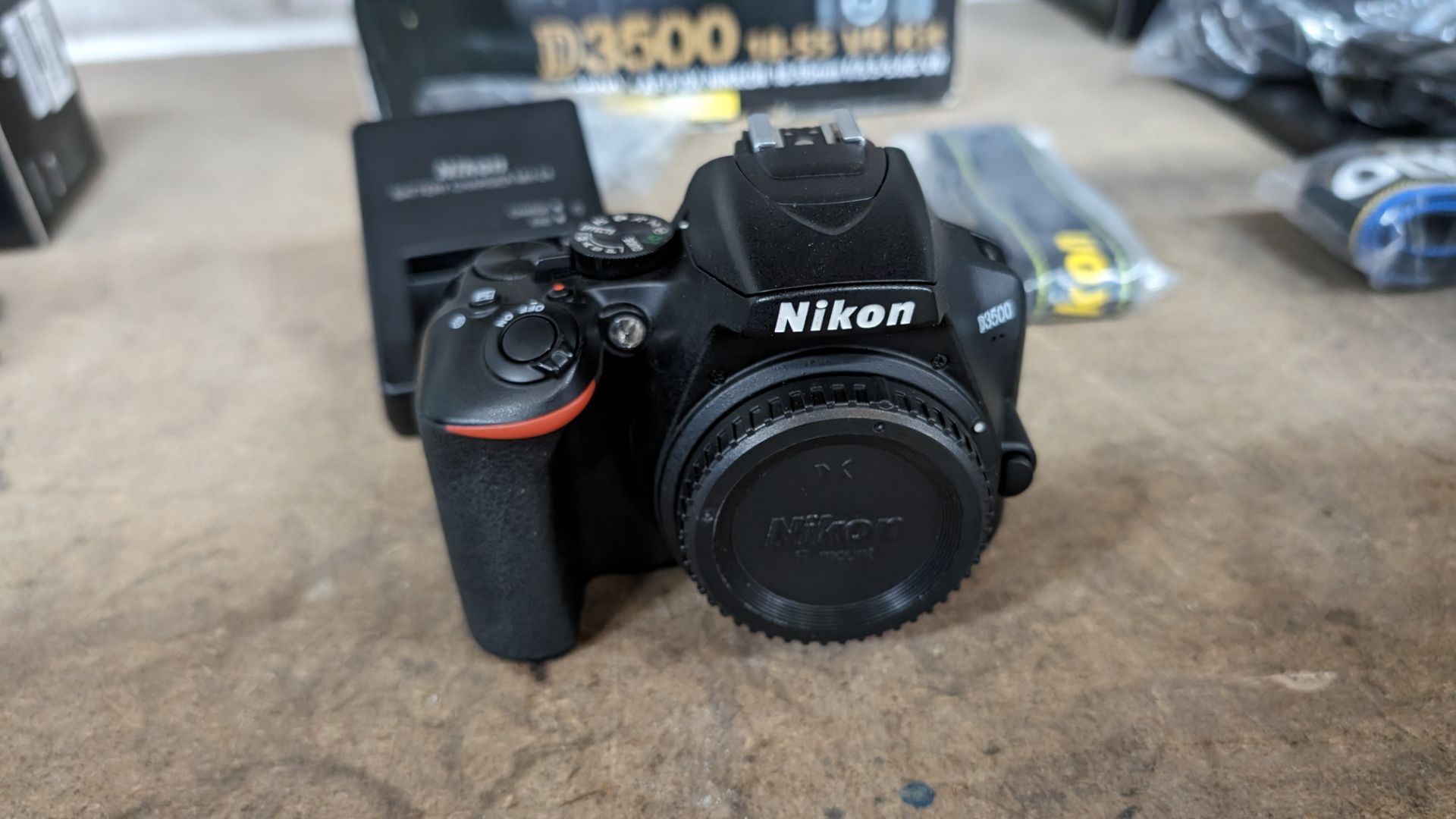 Nikon D3500 camera. Although this camera is in a box for a kit including a lens, this lot just comp