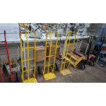 3 off yellow metal sack trucks