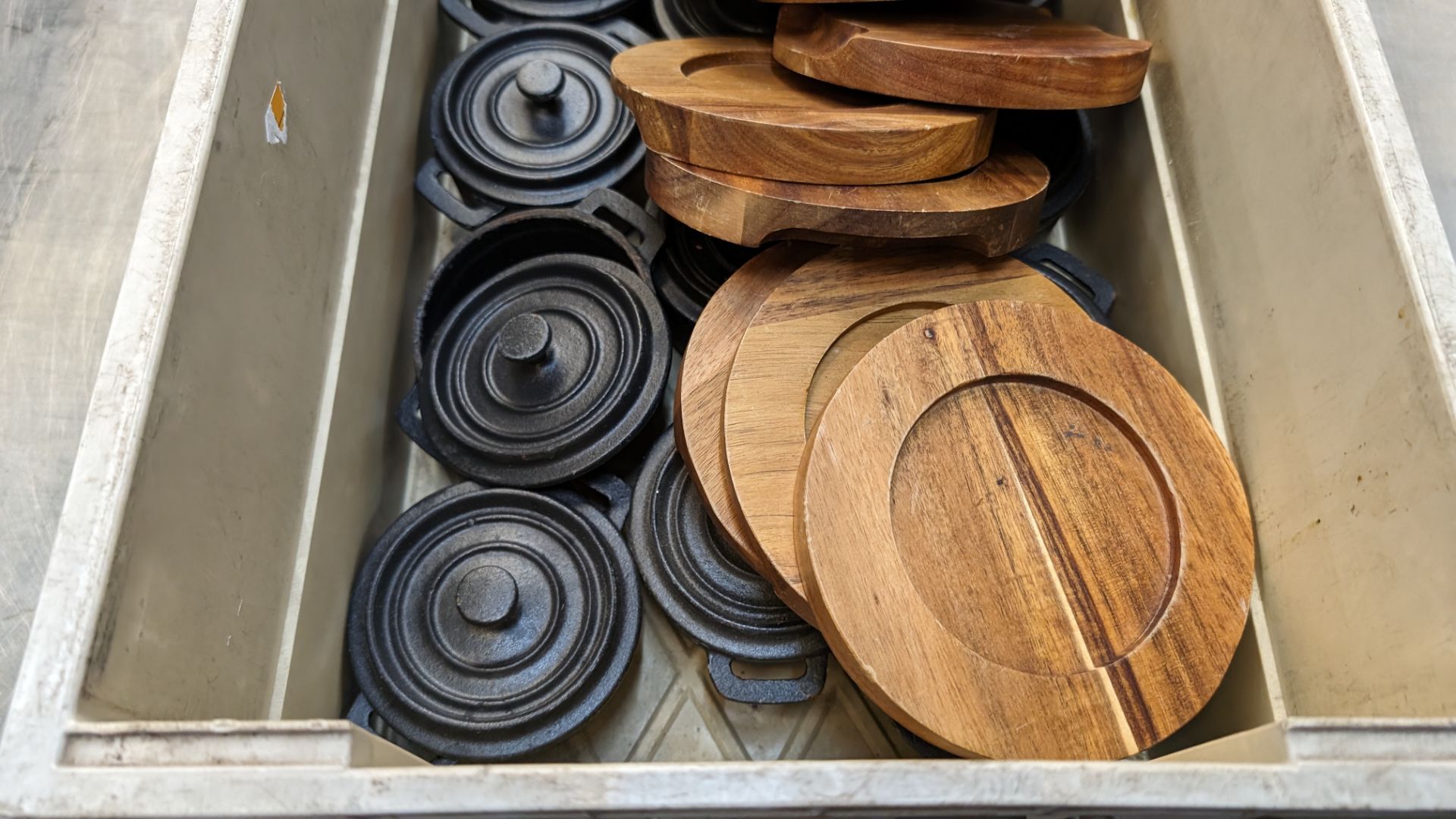 The contents of a crate of Utopia cast iron small pots with lids plus a quantity of wooden stands fo - Image 3 of 6