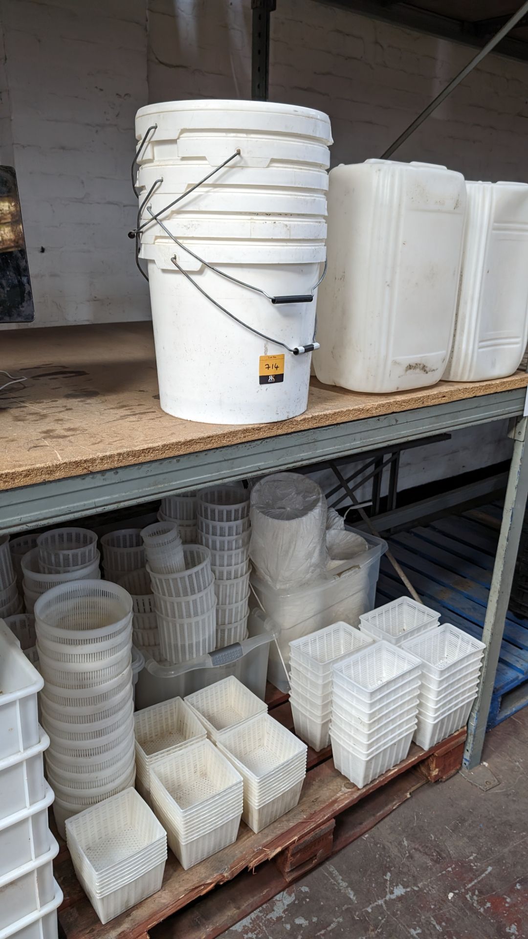 Quantity of plastic receptacles, comprising the contents of a pallet, plus small tubs above same (as