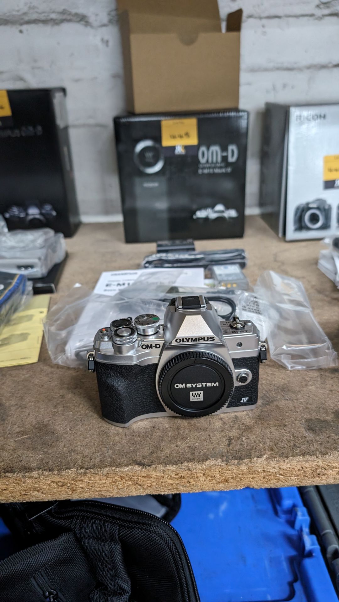 Olympus OM-D E-M10 Mark IV camera, in box, including strap, battery, adaptor and cable