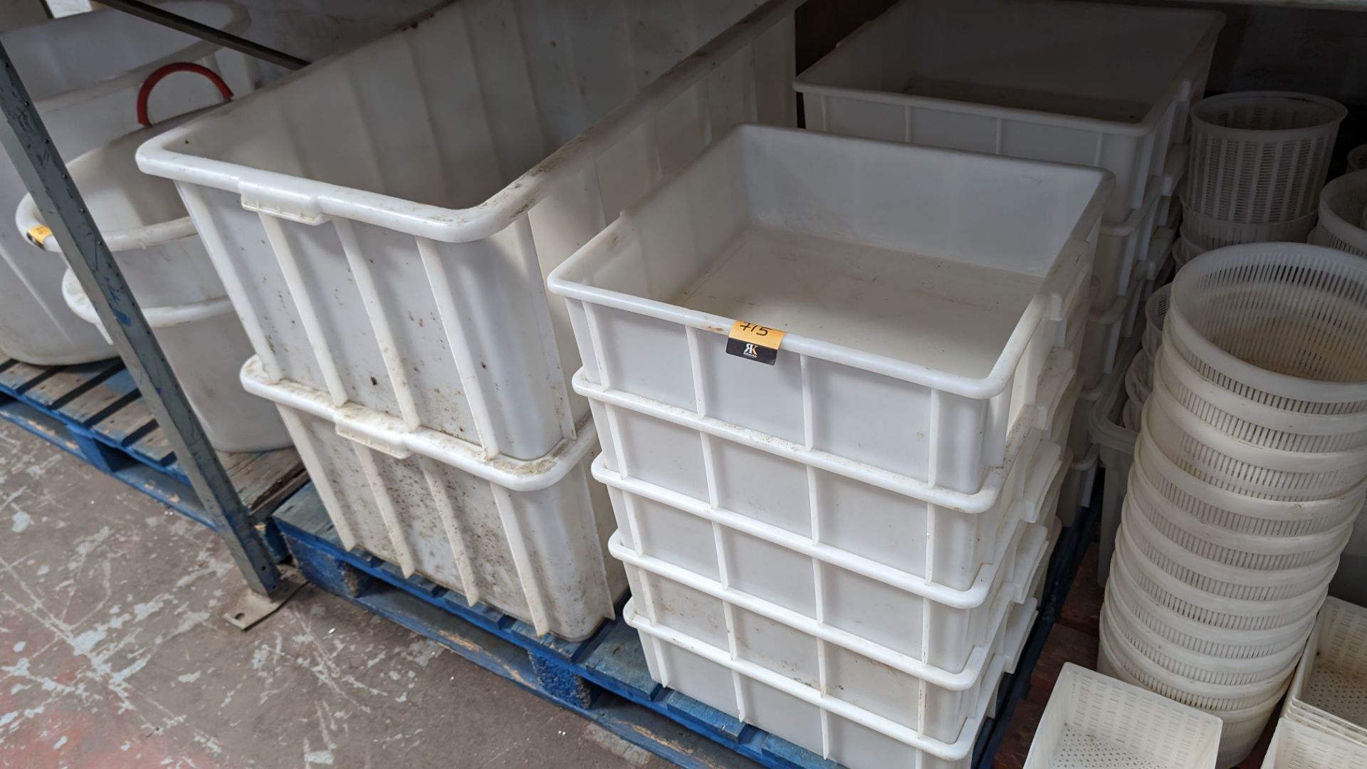 Contents of a pallet of large rectangular and square heavy duty plastic storage bins.
