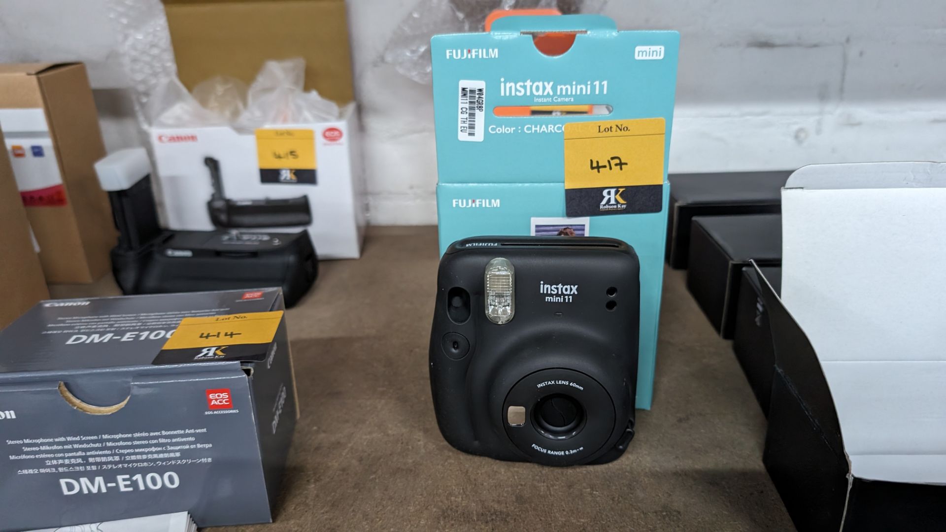Fujifilm Instax Mini 11 instant camera. In charcoal grey