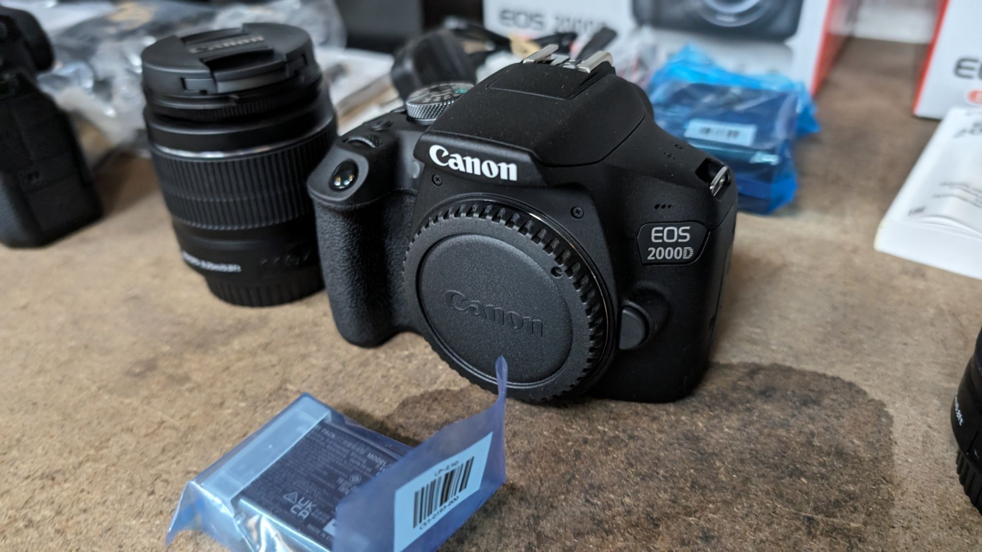 Canon EOS 2000D camera with EFS 18-55mm lens plus battery, charger, strap and more