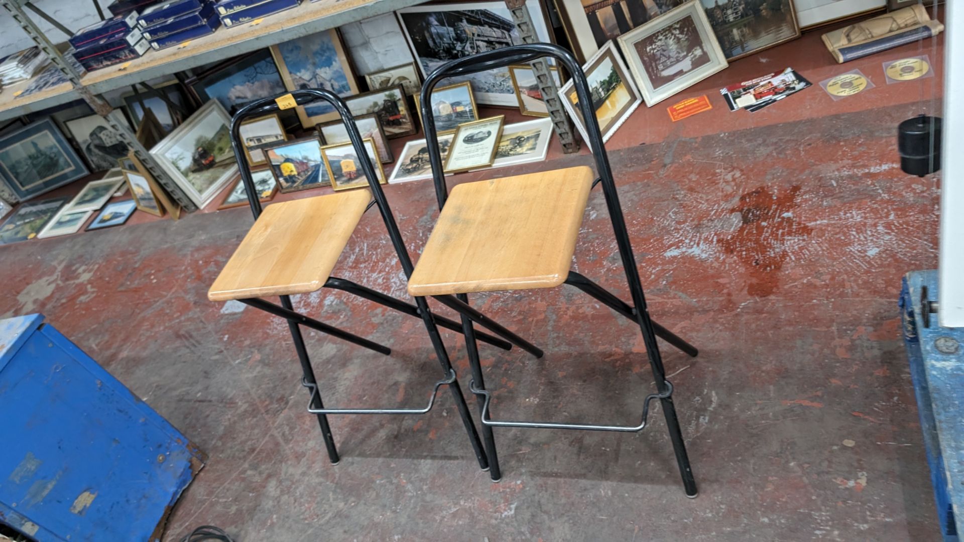 Pair of black metal & wooden folding stools