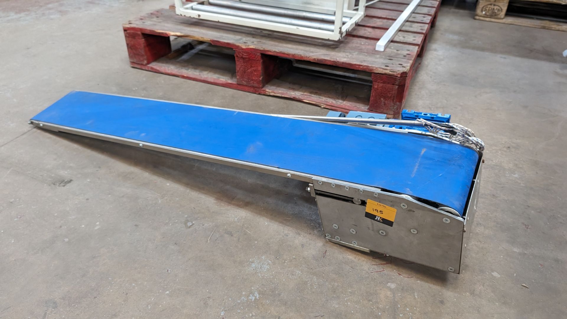 Motorised conveyor with belt approximately 150mm wide. Length of unit approximately 1140mm