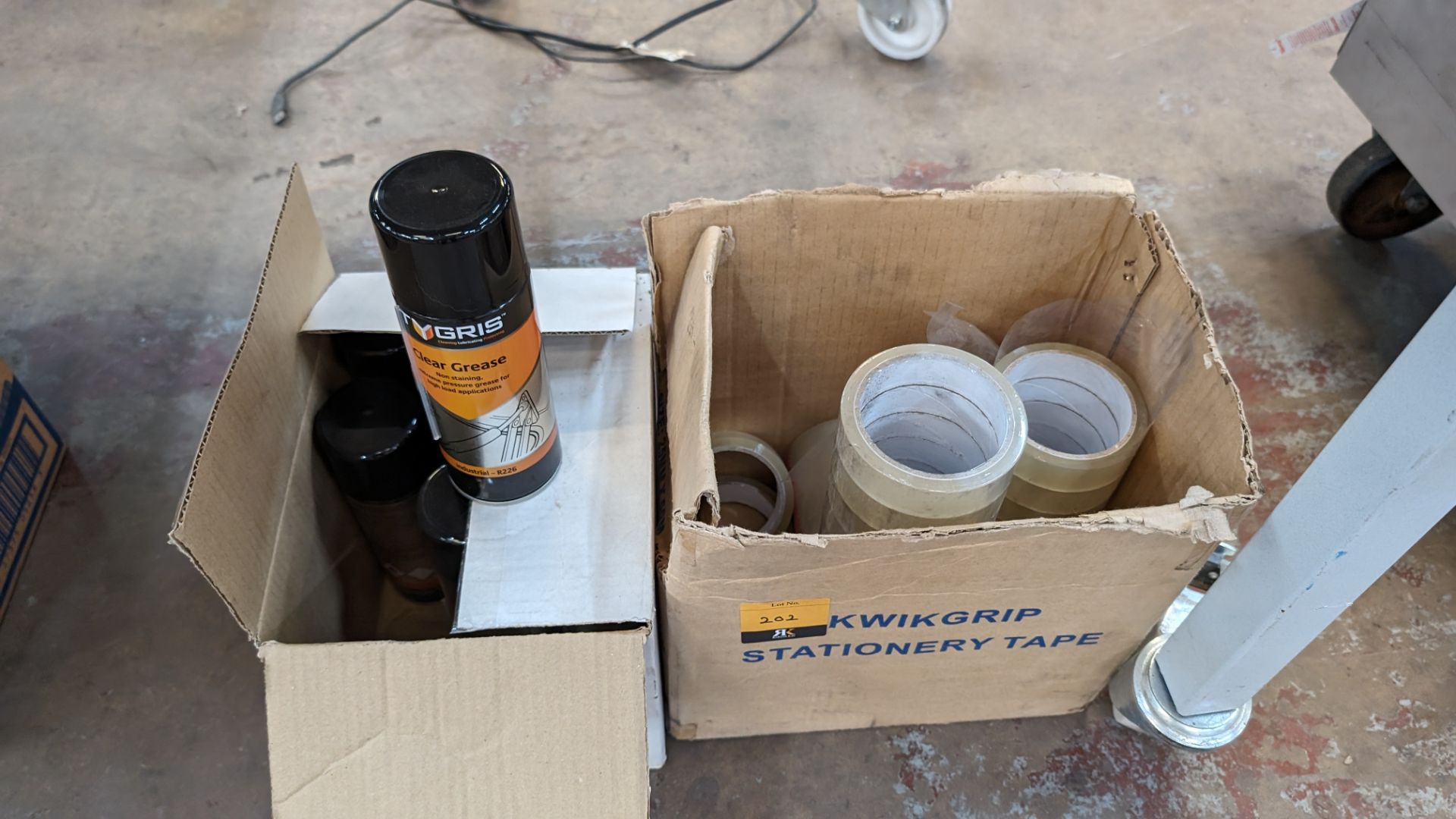 Box of tape plus box of grease spray