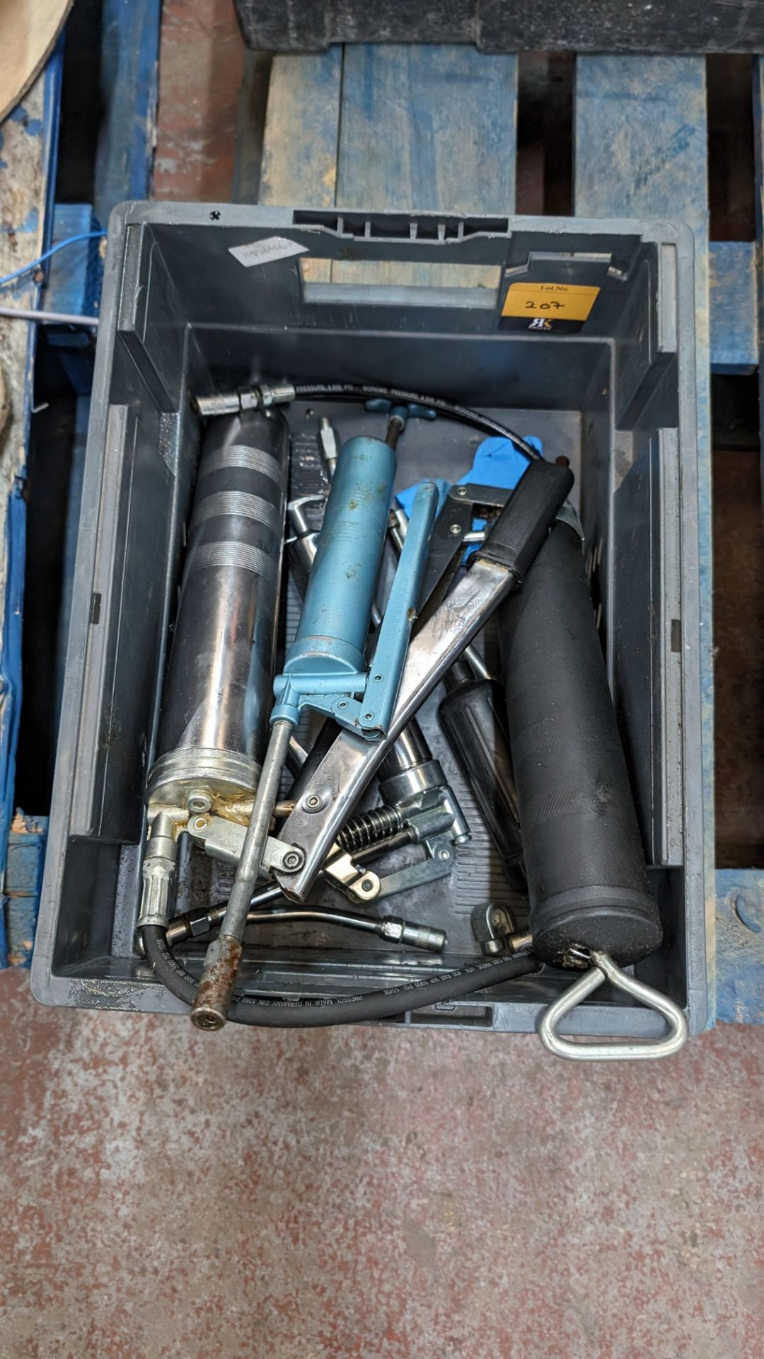 The contents of a crate of grease guns & related