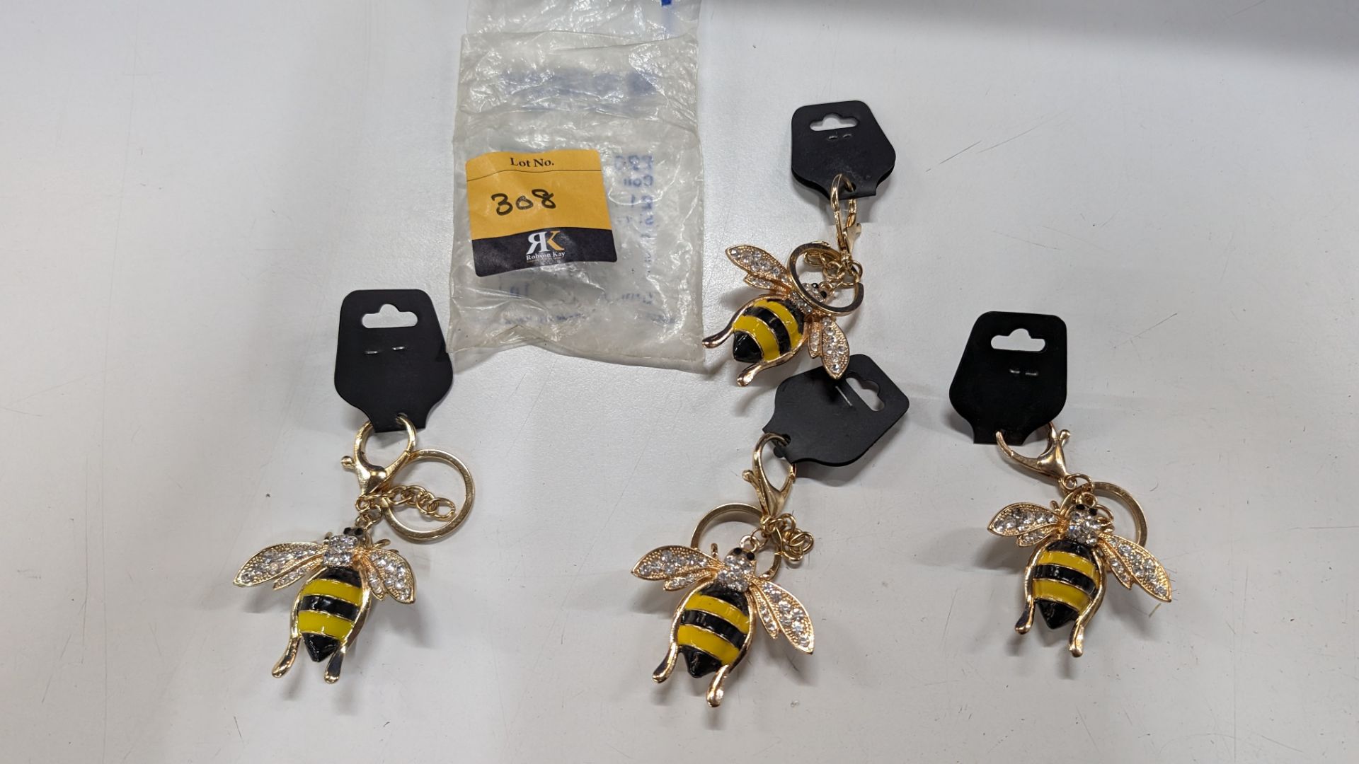 4 off highly decorative bee keyrings