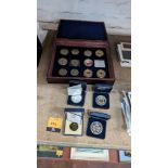 16 assorted small decorative coins comprising large presentation case with 12 coins plus 4 individua