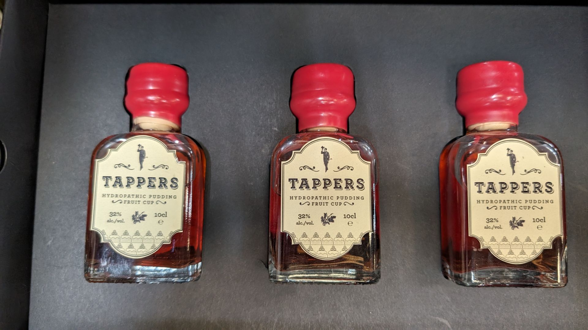 3 off 100ml bottles of Tappers Hydropathic Pudding Fruit Cup, 32% ABV, including a Tappers branded p - Image 4 of 7