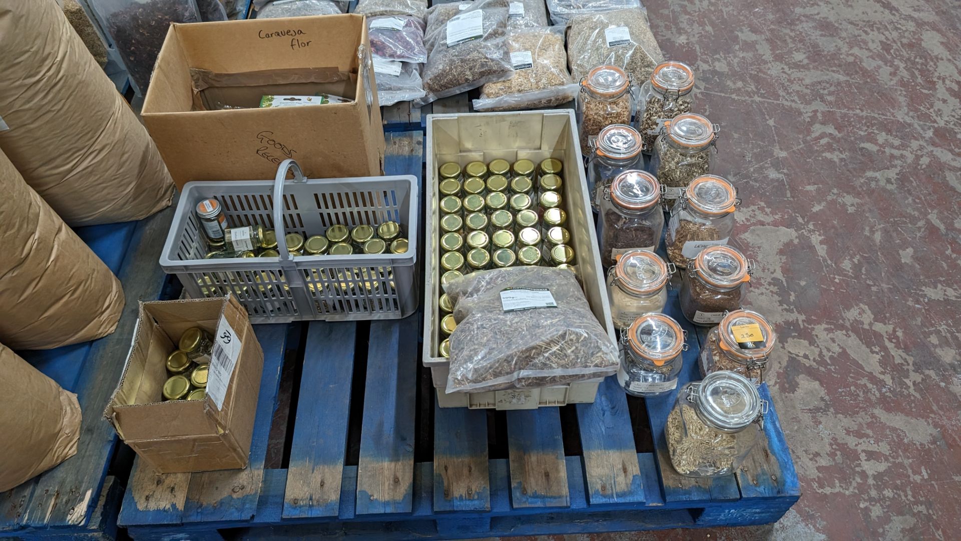 The contents of a pallet of assorted herbs, spices, aromats and more, including all the small glass