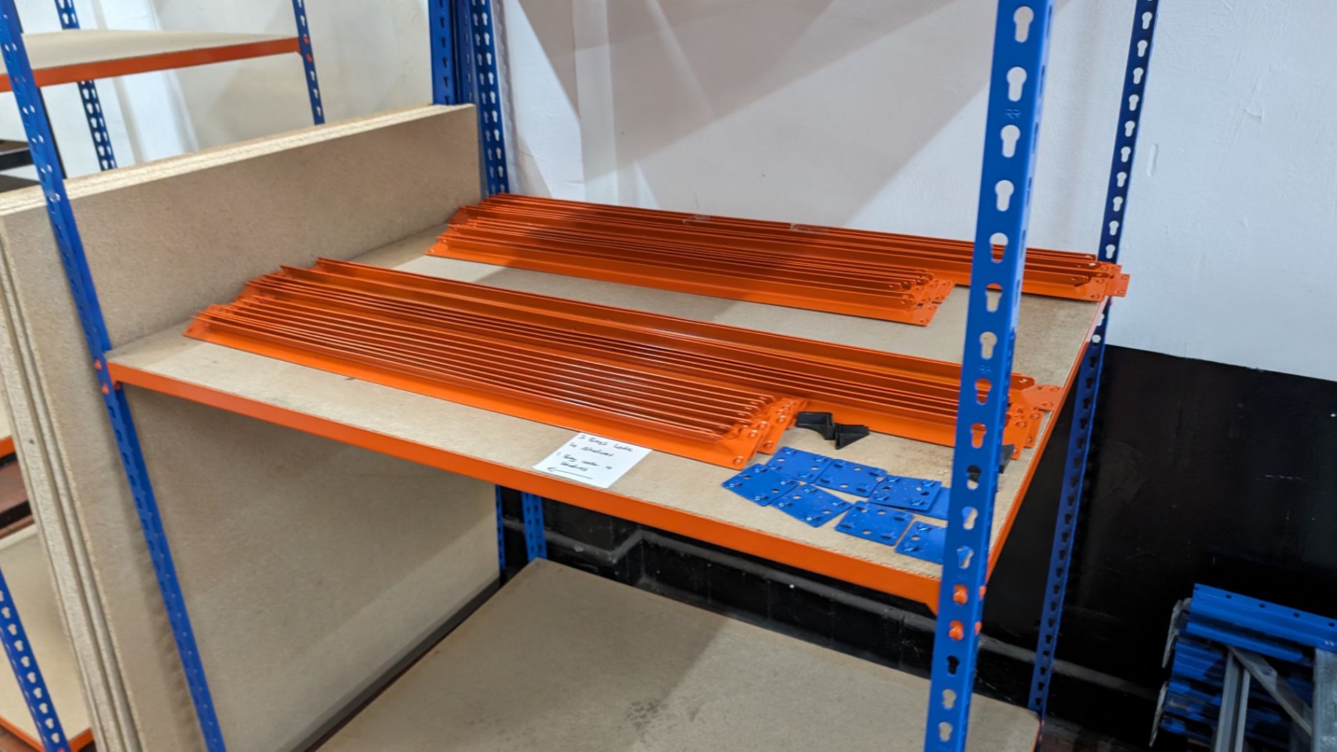 4 off bays of Rapid Racking blue and orange racking, each with four shelves. One bay has a footprin - Image 6 of 8