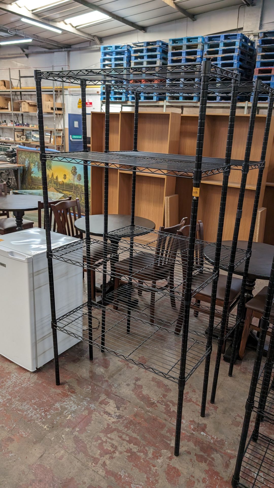 2 off black metal bolt free bolt free wire racks each with four shelves, each measuring approximatel