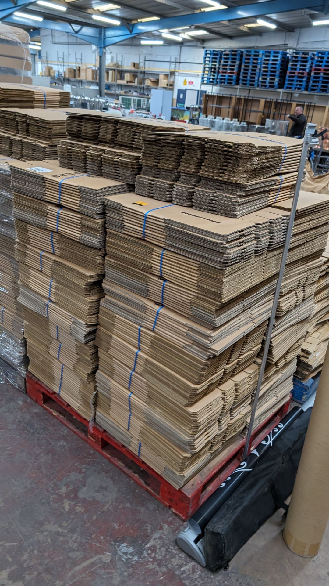 The contents of a pallet of flatpack cardboard boxes in 4 stacks. Each box when assembled incorpora