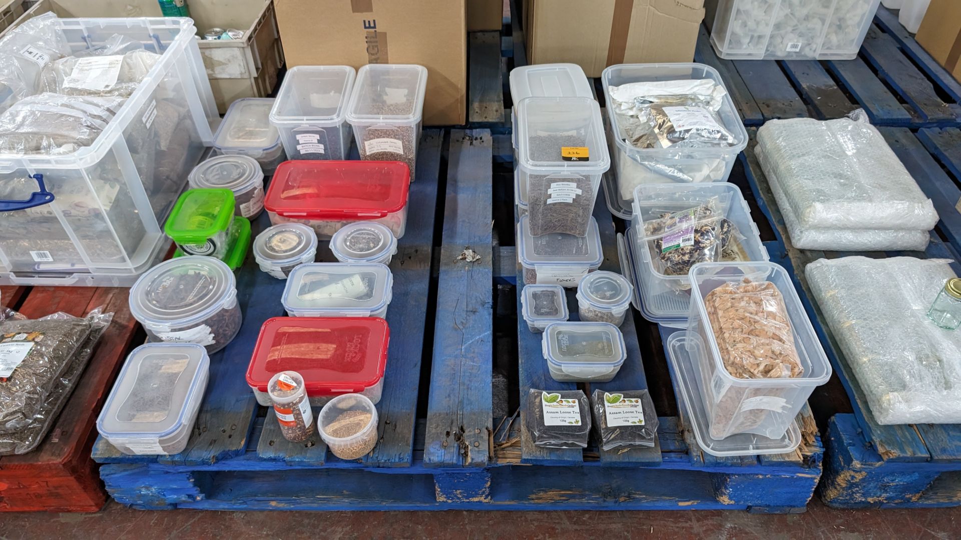 The contents of a pallet of assorted aromats and other dried ingredients, including the tubs/crates