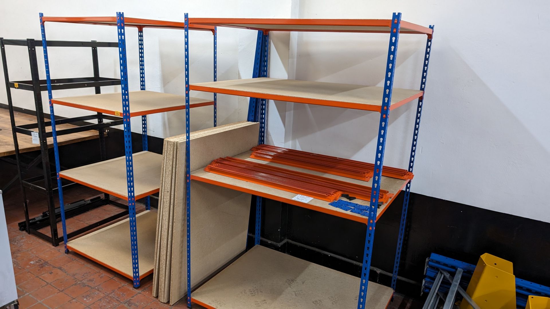 4 off bays of Rapid Racking blue and orange racking, each with four shelves. One bay has a footprin - Image 2 of 8