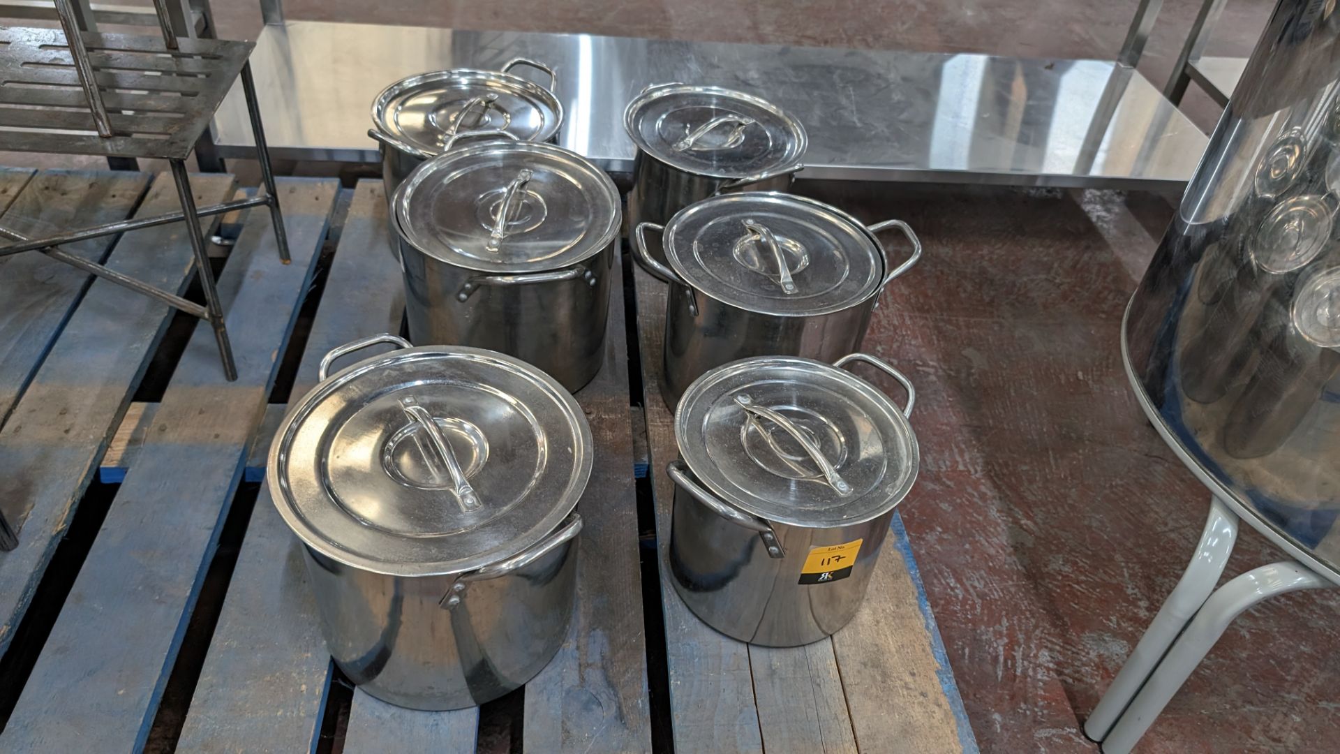 6 off twin handled steel pots, each with their own lid
