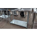 Stainless steel twin tier table with upstand at rear, max dimensions: 940mm x 610mm x 1220mm