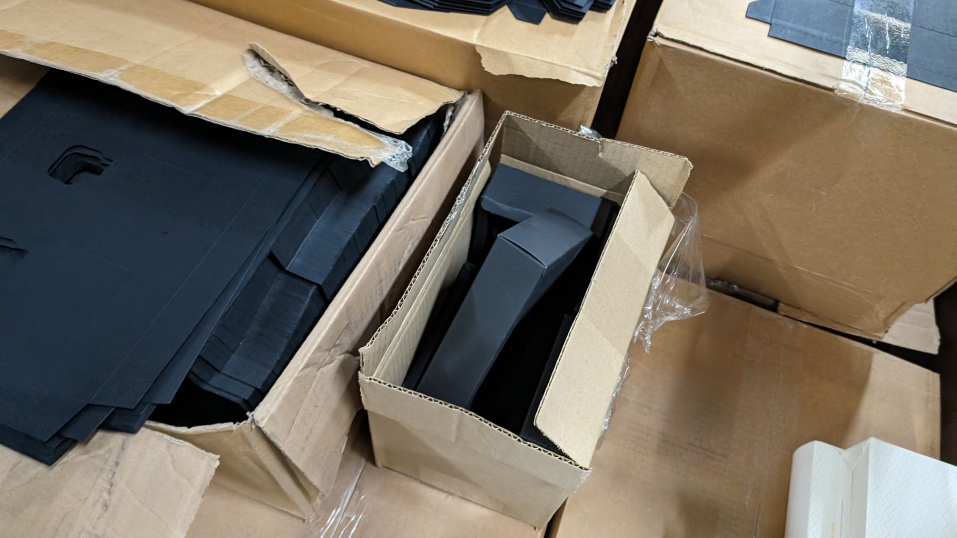 The contents of a pallet of assorted packaging materials primarily comprising flatpack black boxes b - Image 5 of 12