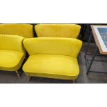 Pair of mustard yellow velour two-person small sofas, each measuring approximately 1120mm wide
