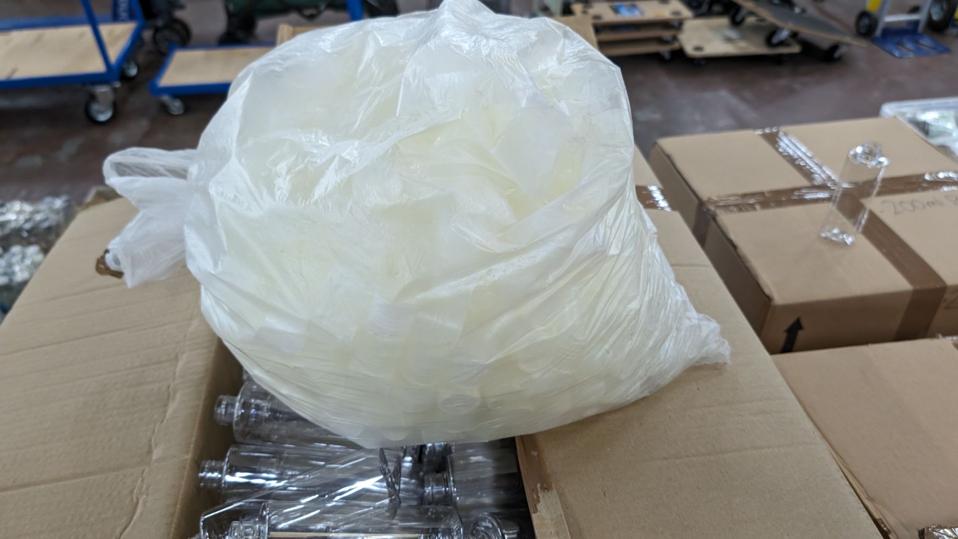 Large quantity of empty plastic 200ml bottles, including large quantity of caps and large quantity o - Image 5 of 9